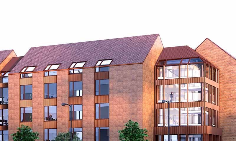 Flot facade af ejendom på Strandboulevarden 130, med stort lys indgangsparti